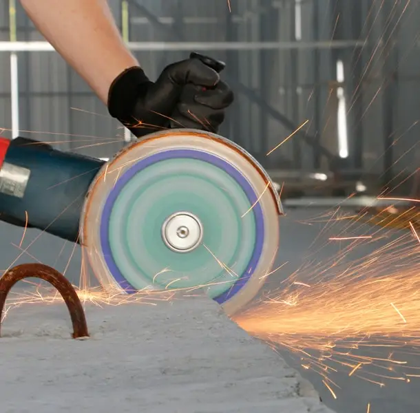 Cutting construction materials on an angle grinder
